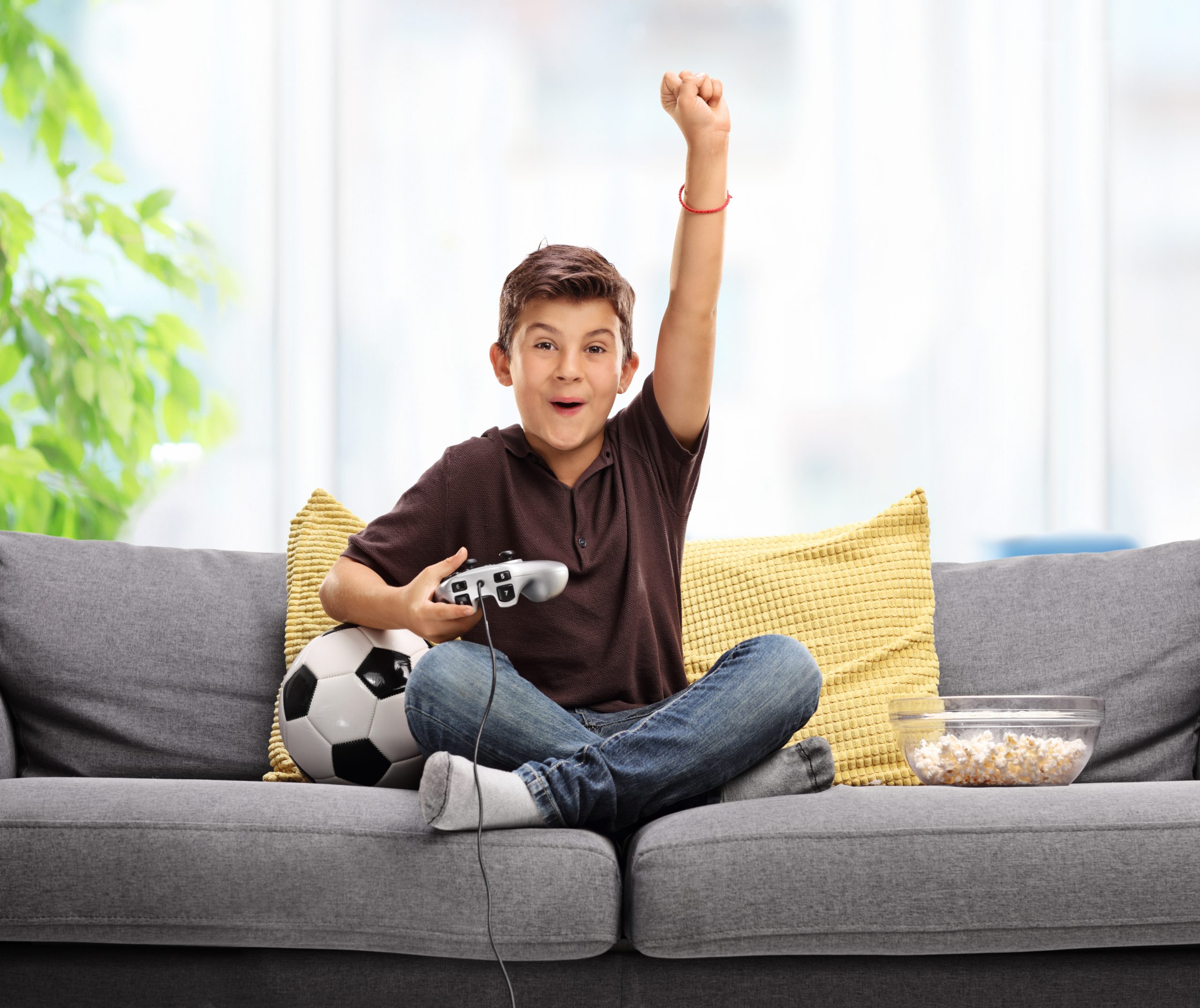 Young boy playing language learning video games.